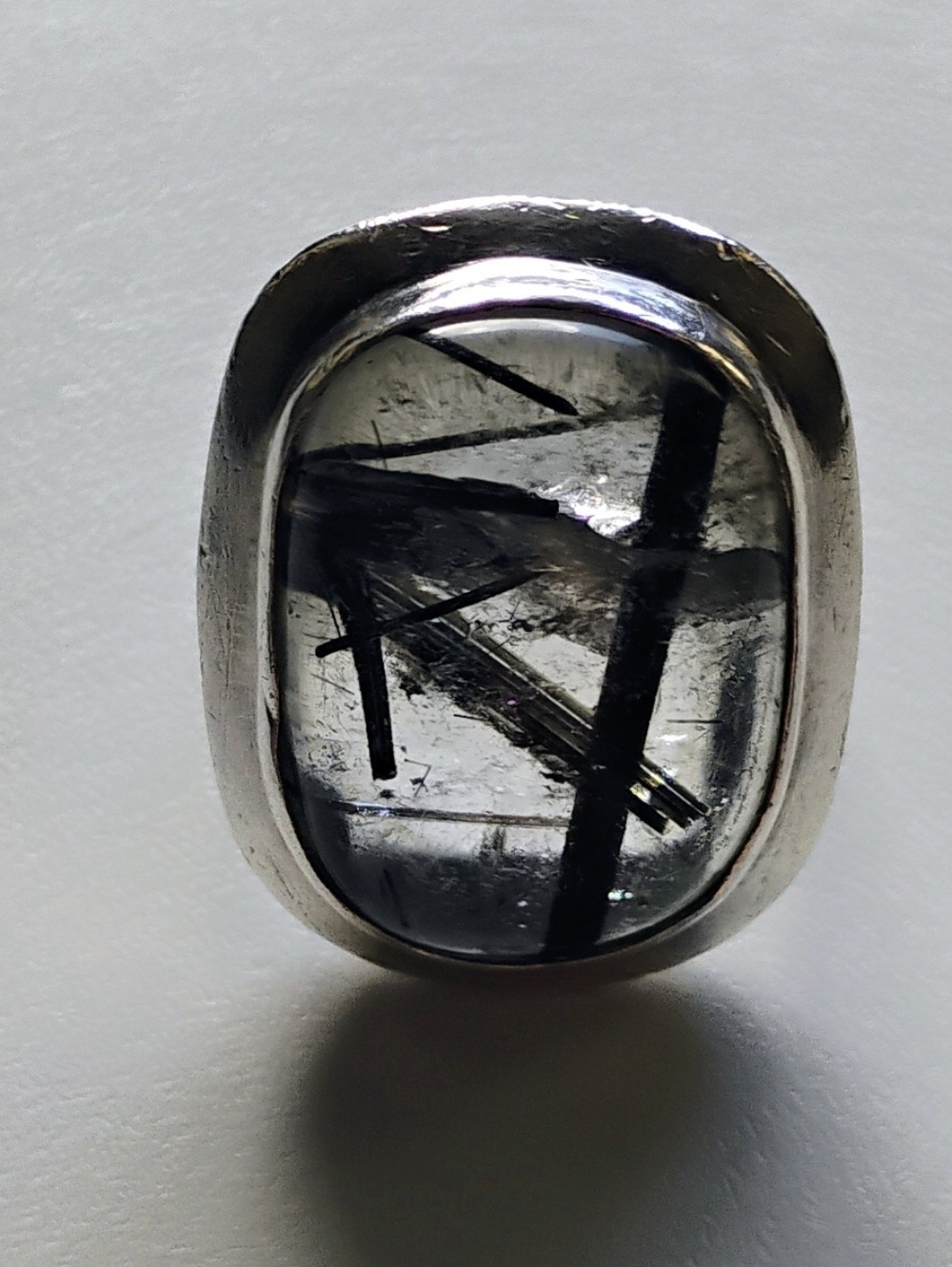 Large sterling and quartz ring with a black tourmaline inclusion. Sold as is.